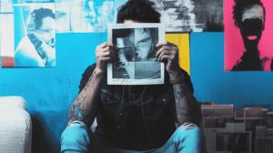 A marketer holding printouts of record campaign 1